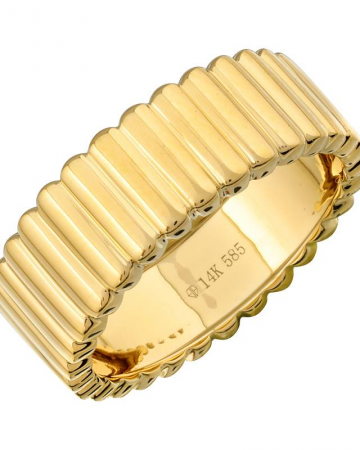 Gold ring with ribbed design on a white background