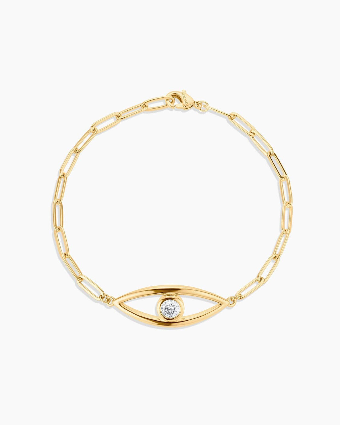 Gold bracelet with eye-shaped clasp on a white background