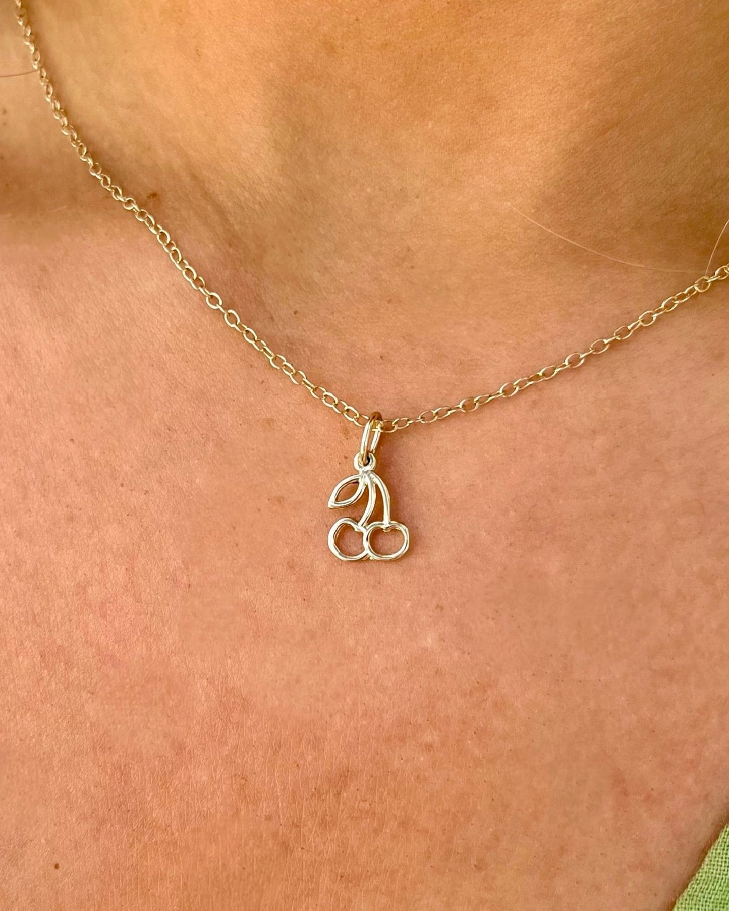 14kt yellow gold chaerry charm on gold chain necklace @dylanjamesjewelry.com