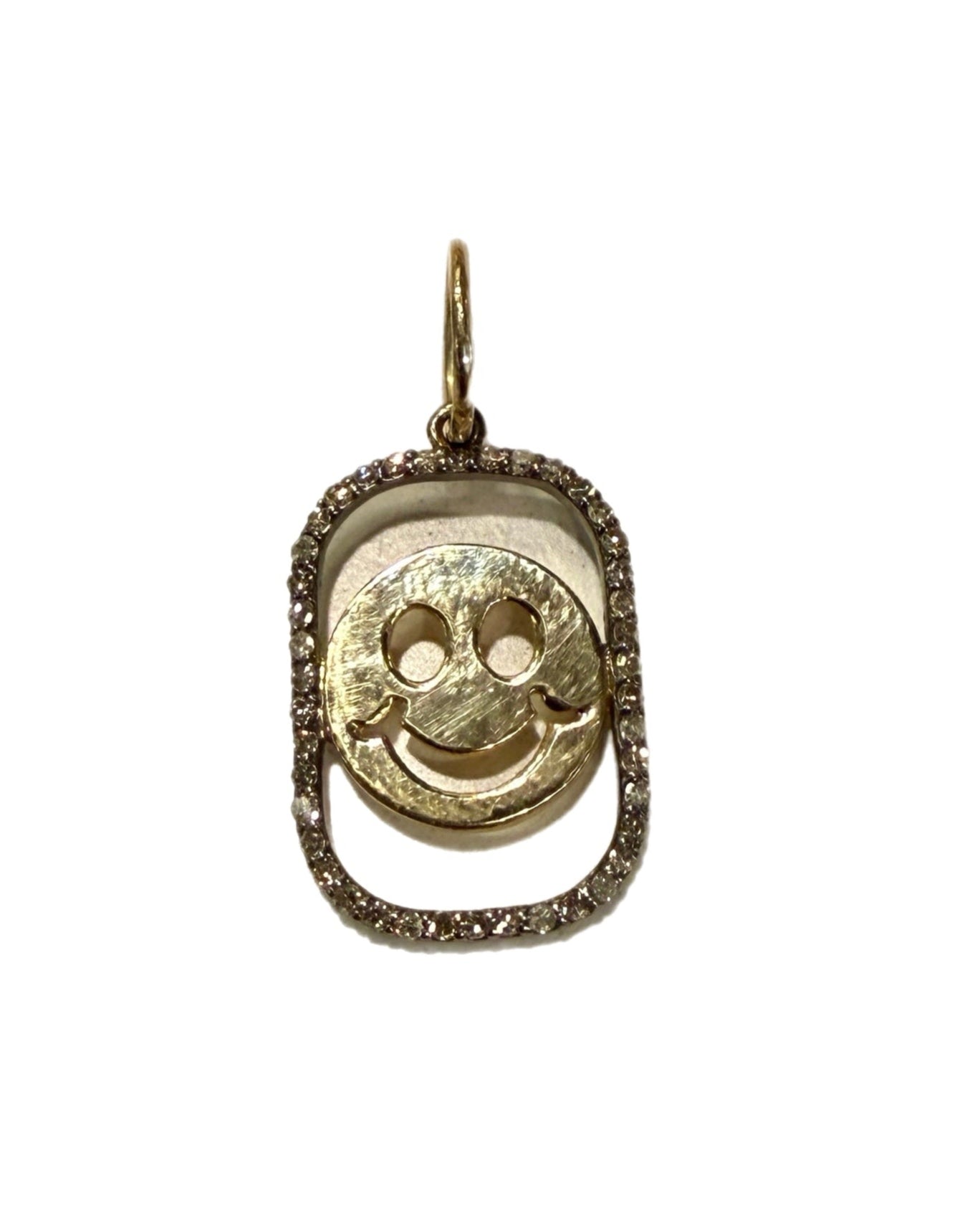 Gold pendant with a smiley face design on a white background