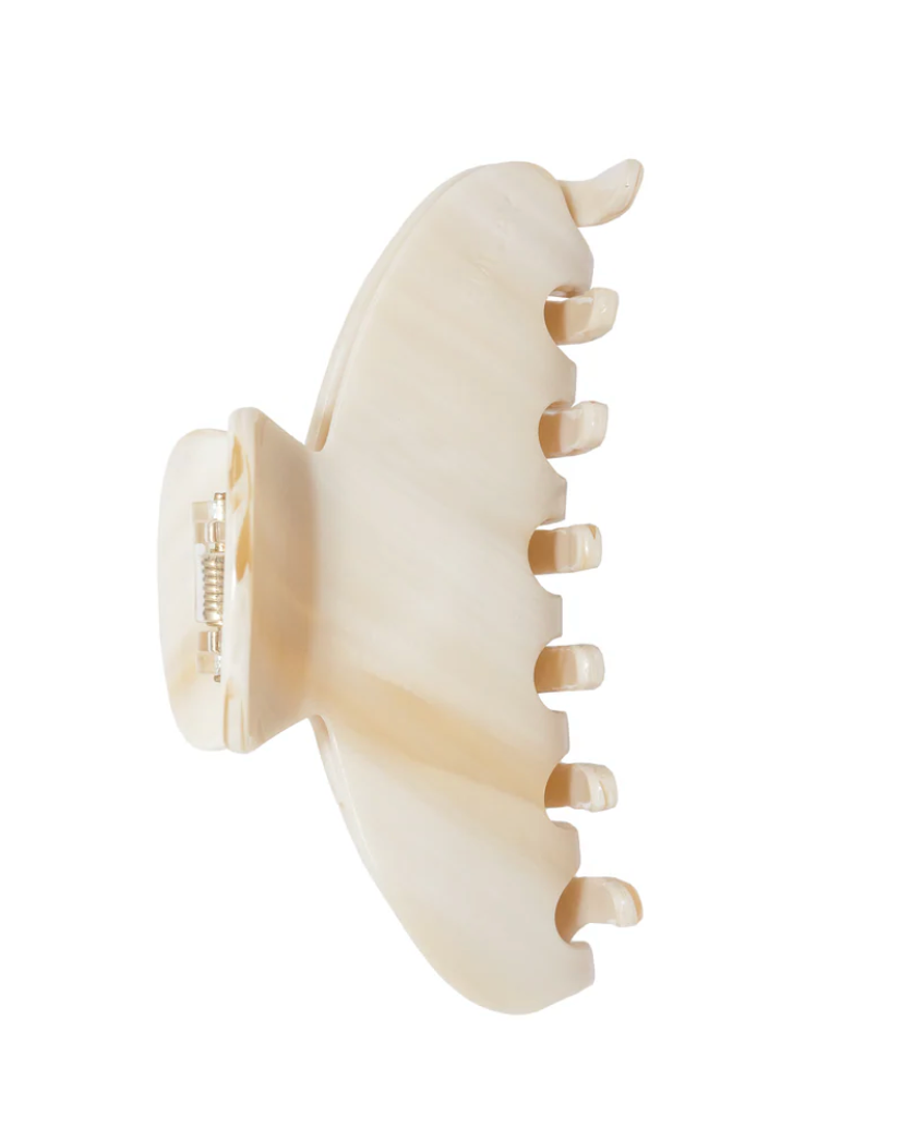 Beige hair clip on a white background