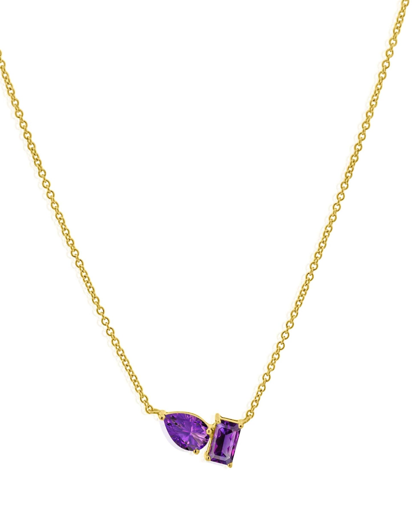 The AIRA BARNEY Amethyst Necklace features two purple gemstones—a marquise-cut and a rectangular-cut—set side by side in 14kt yellow gold. This adjustable piece combines elegance with versatility.