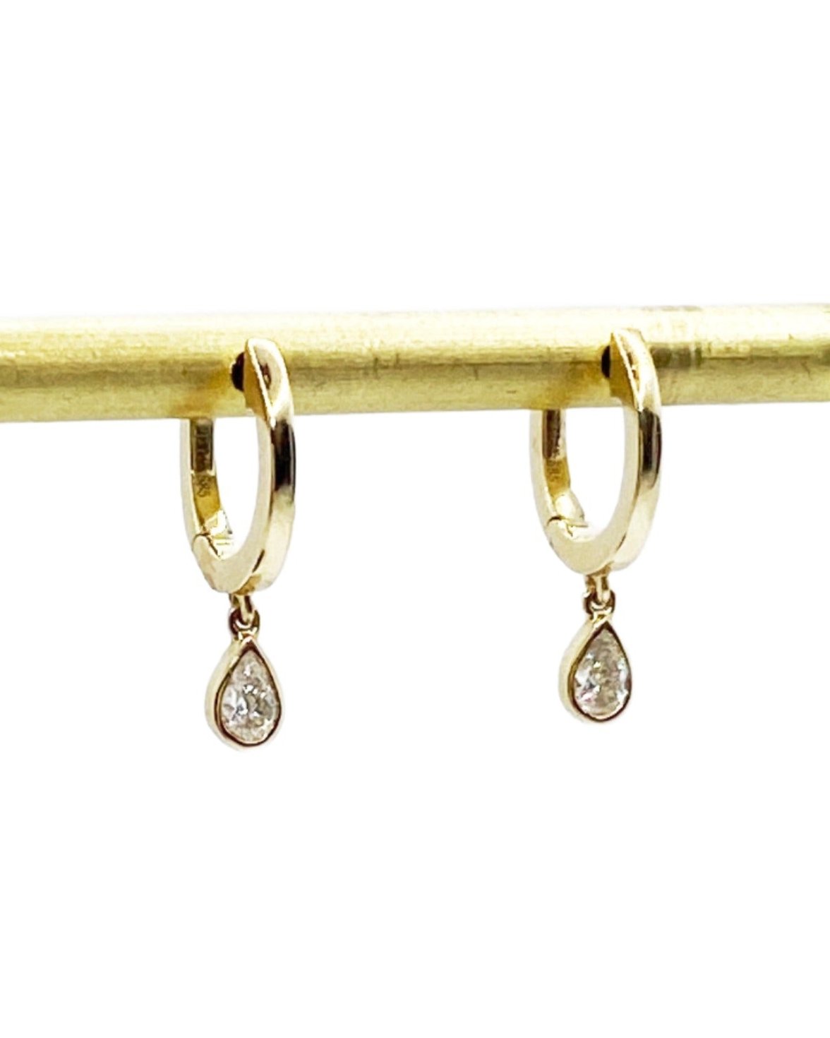 yellow gold hoop earrings with pear shape diamond drops @dylanjamesjewelry.com