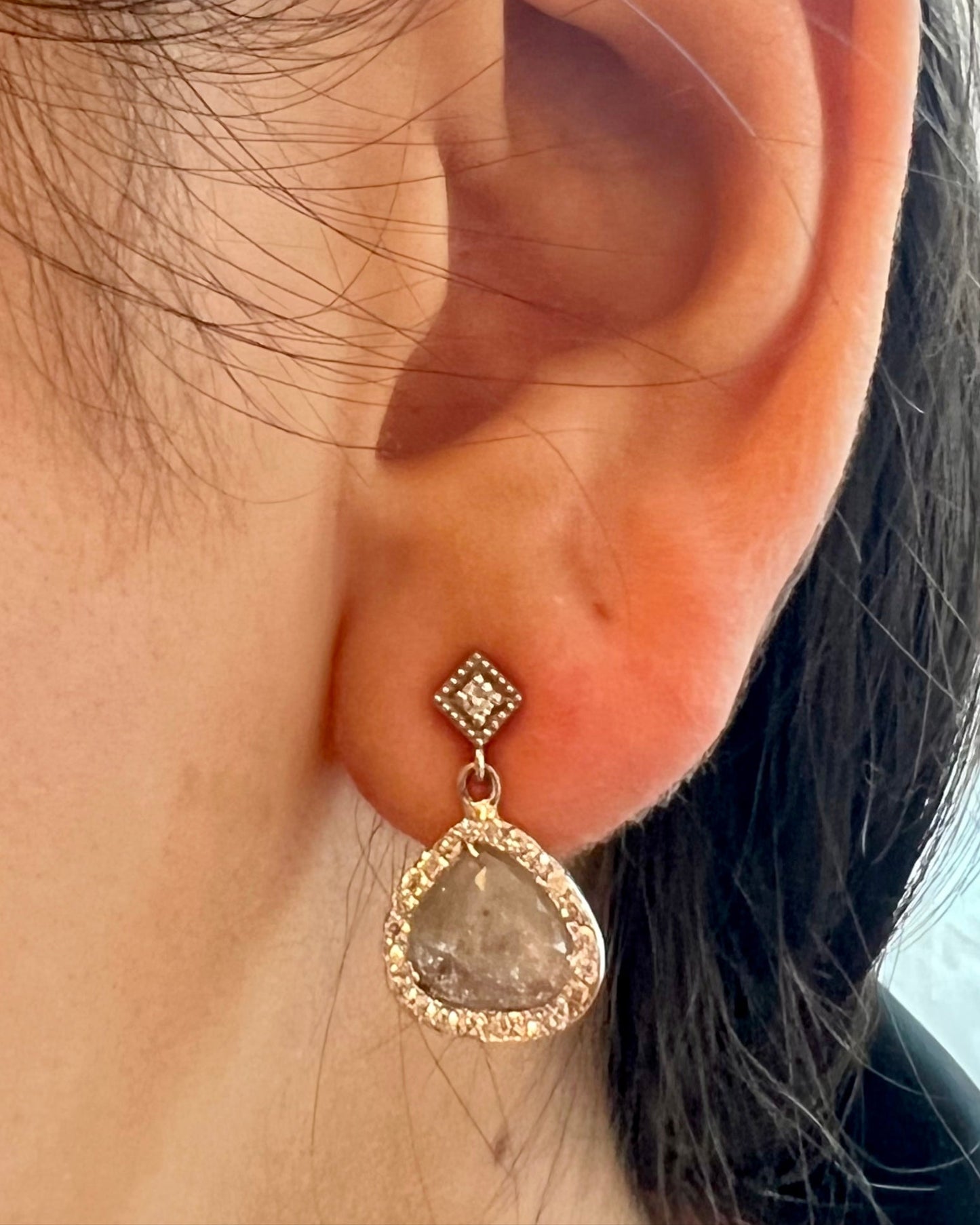 14kt whote gols diamond post earrings oth a dismond slice drop surrounded by smaller diamonds @dylanjamesjewelry.Com