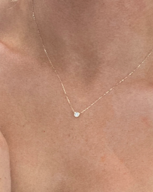 yellow gold chain with diamond solitaire bezel set diamond necklace  @dylanajmesjewelry.com