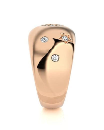 The DEBBIE Diamond Ring by Dylan James Jewelry features a dazzling 14kt rose gold design with three brilliant diamond accents in a unique star-shaped setting, beautifully showcased against a pristine white background.