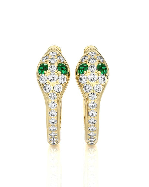 A pair of gold snake-head stud earrings set with green emerald-cut stones and pavé diamonds on a white background.