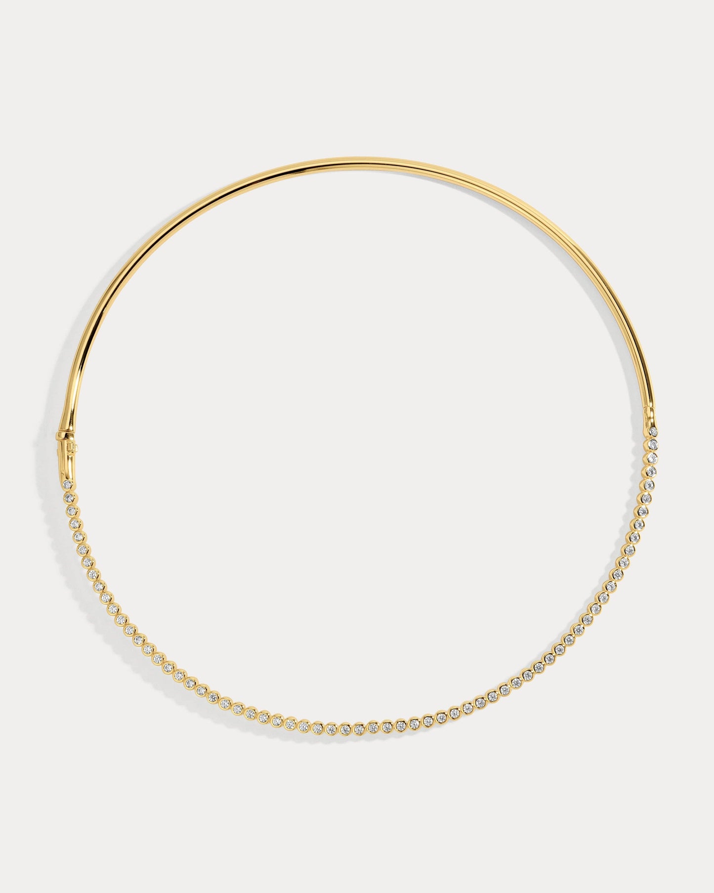 Gold hoop collar necklace on a white background