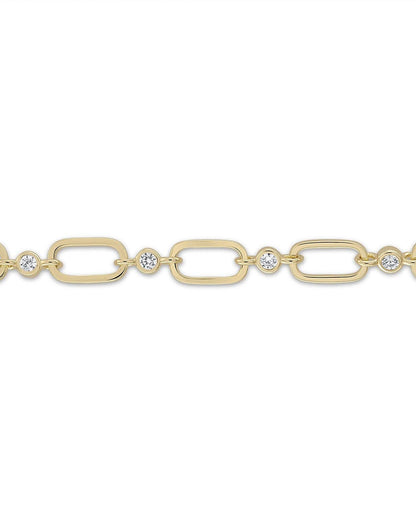 Gold chain bracelet with embedded diamonds on a white background