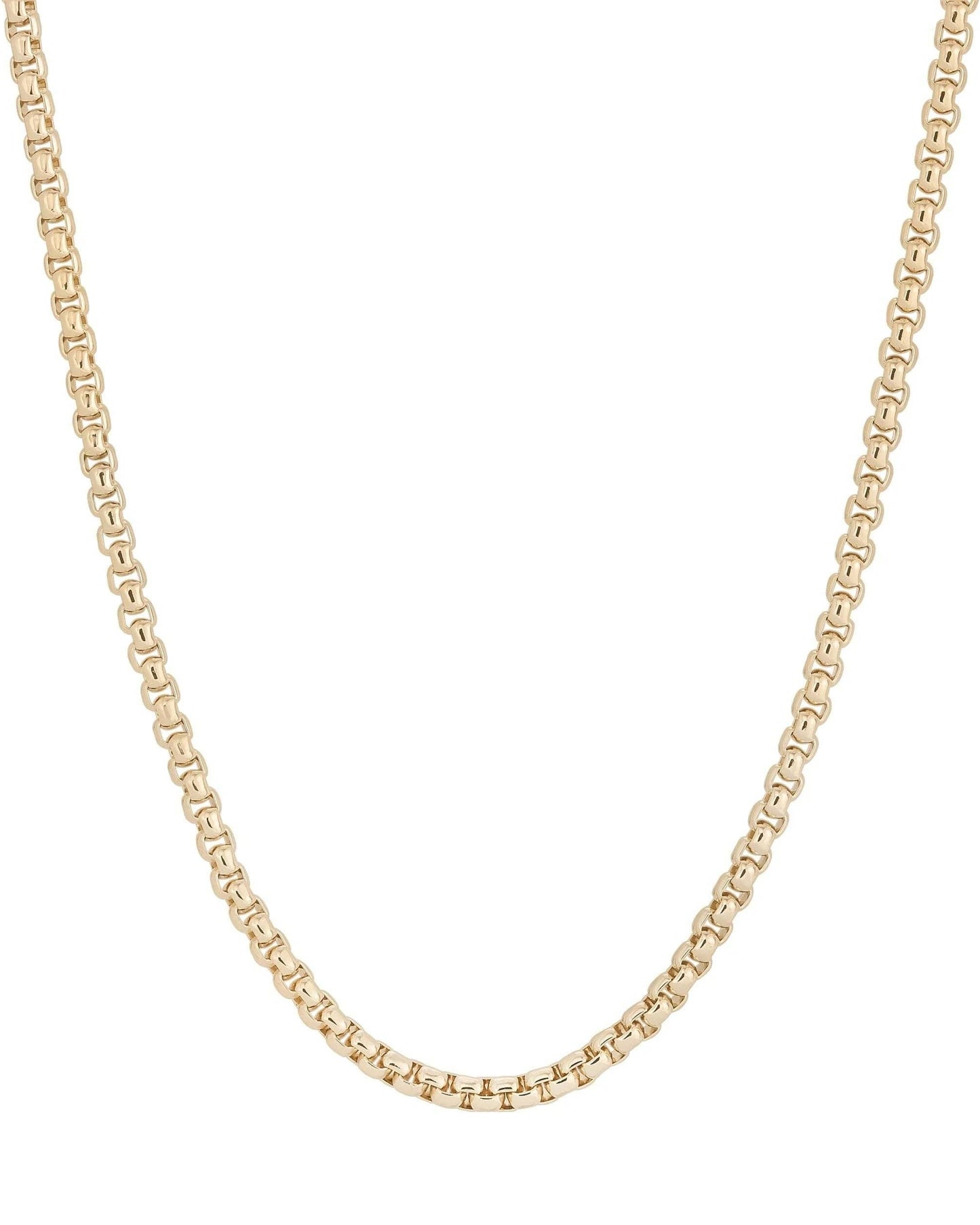 Gold chain necklace on a white background