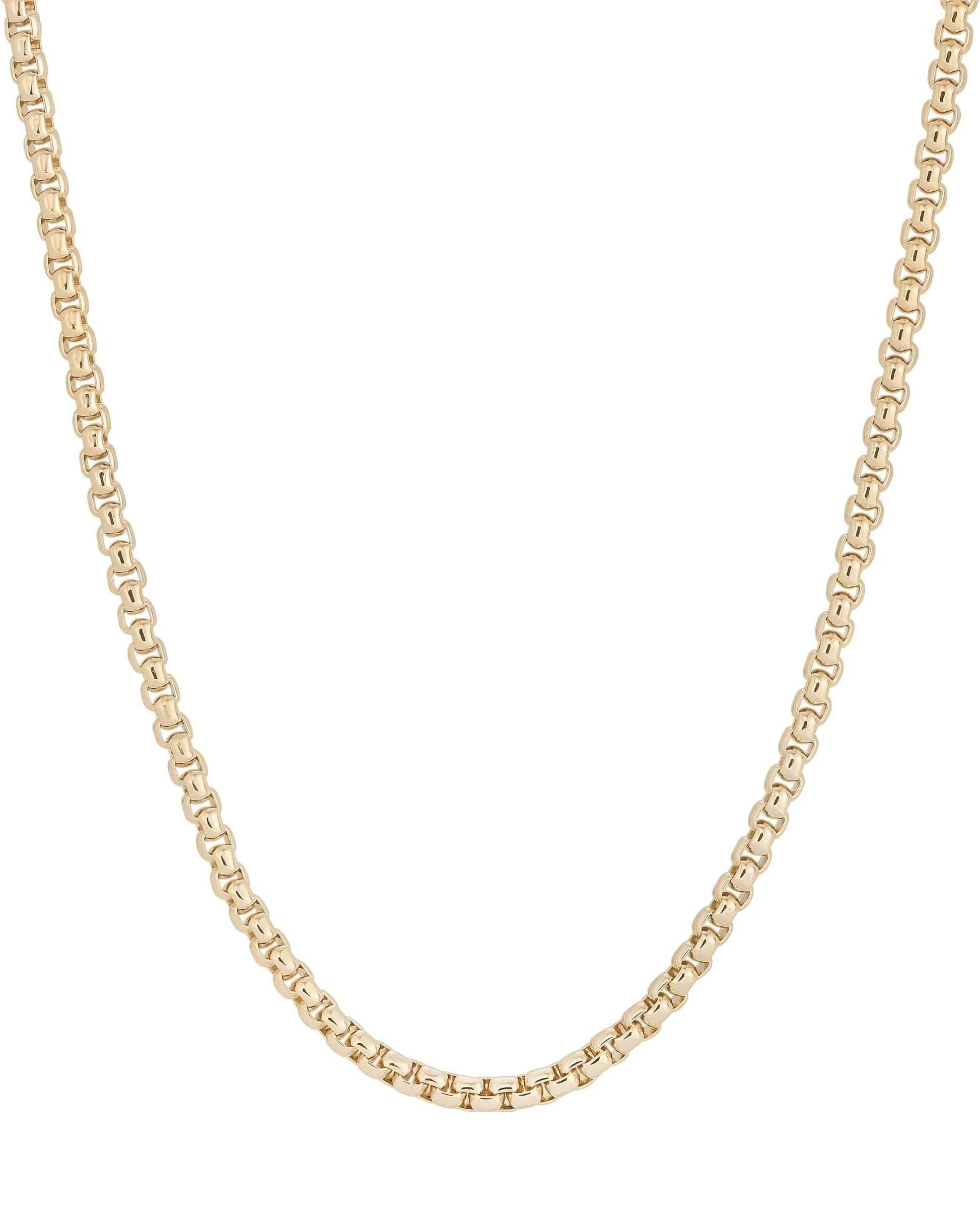 Gold chain necklace on a white background