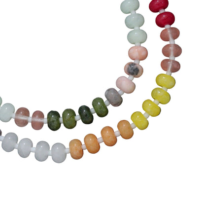 Two beaded necklaces on a dark gray background