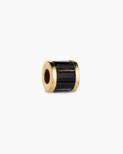 Gold and black cylindrical object on a white background