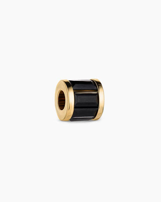 Gold and black cylindrical object on a white background