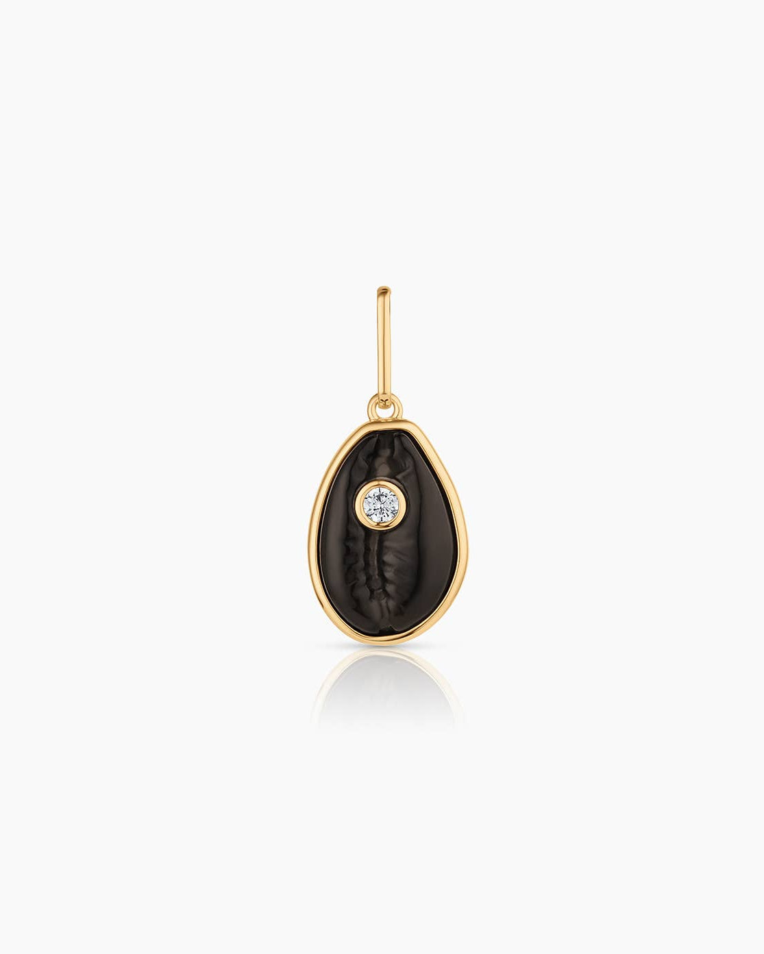 Gold pendant with black stone and diamond on a white background