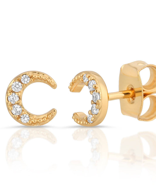 Gold moon-shaped earrings with small diamonds on a white background