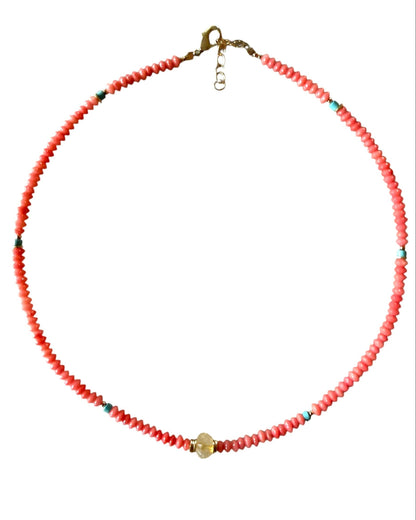 Necklace with red beads on a white background
