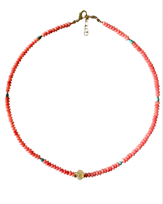 Necklace with red beads on a white background