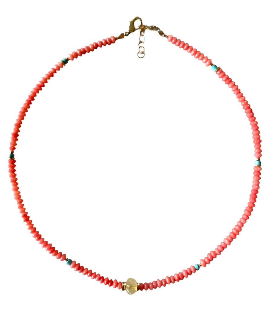 Necklace with red beads on a white background