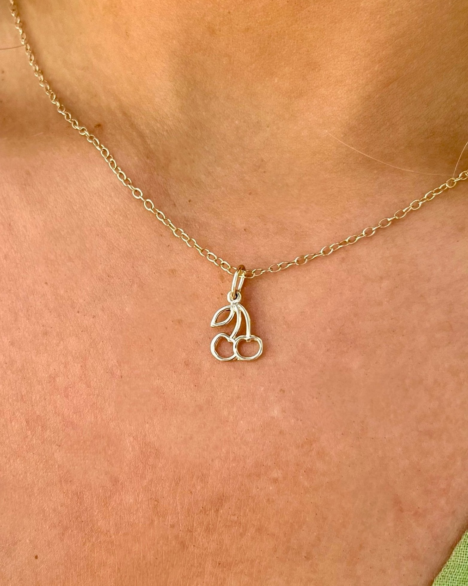 14kt yellow gold chaerry charm on gold chain necklace @dylanjamesjewelry.com