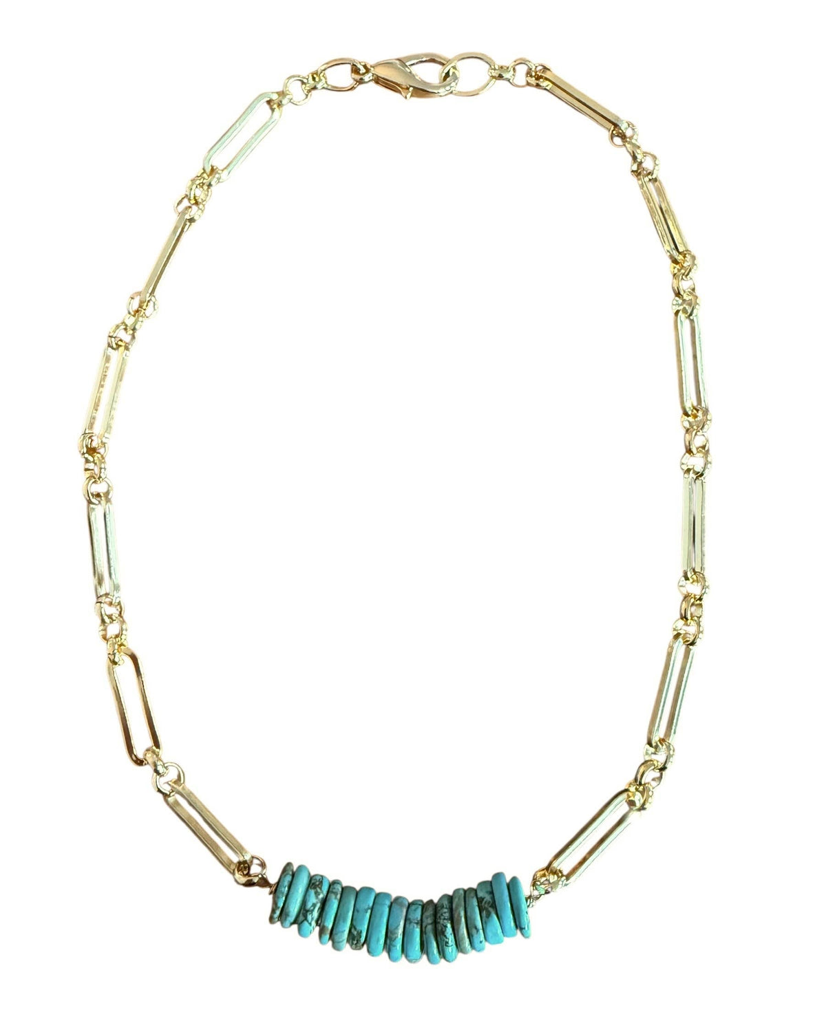 Gold necklace with turquoise beads on a white background