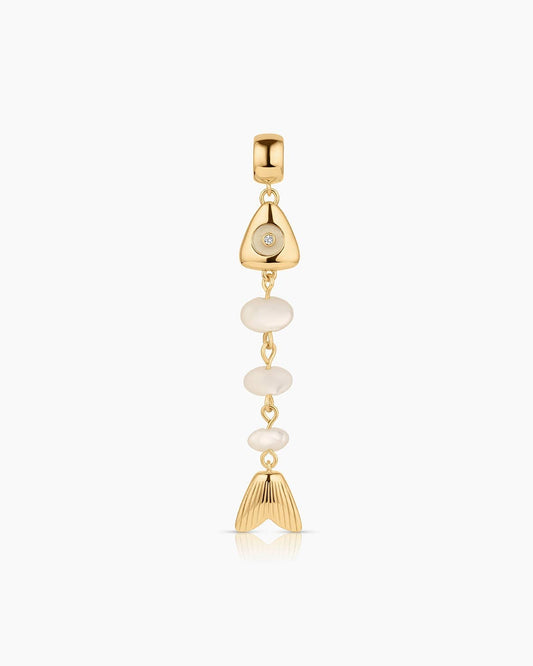 Gold and pearl pendant on a white background
