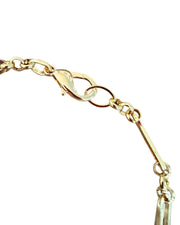 Gold necklace on a white background