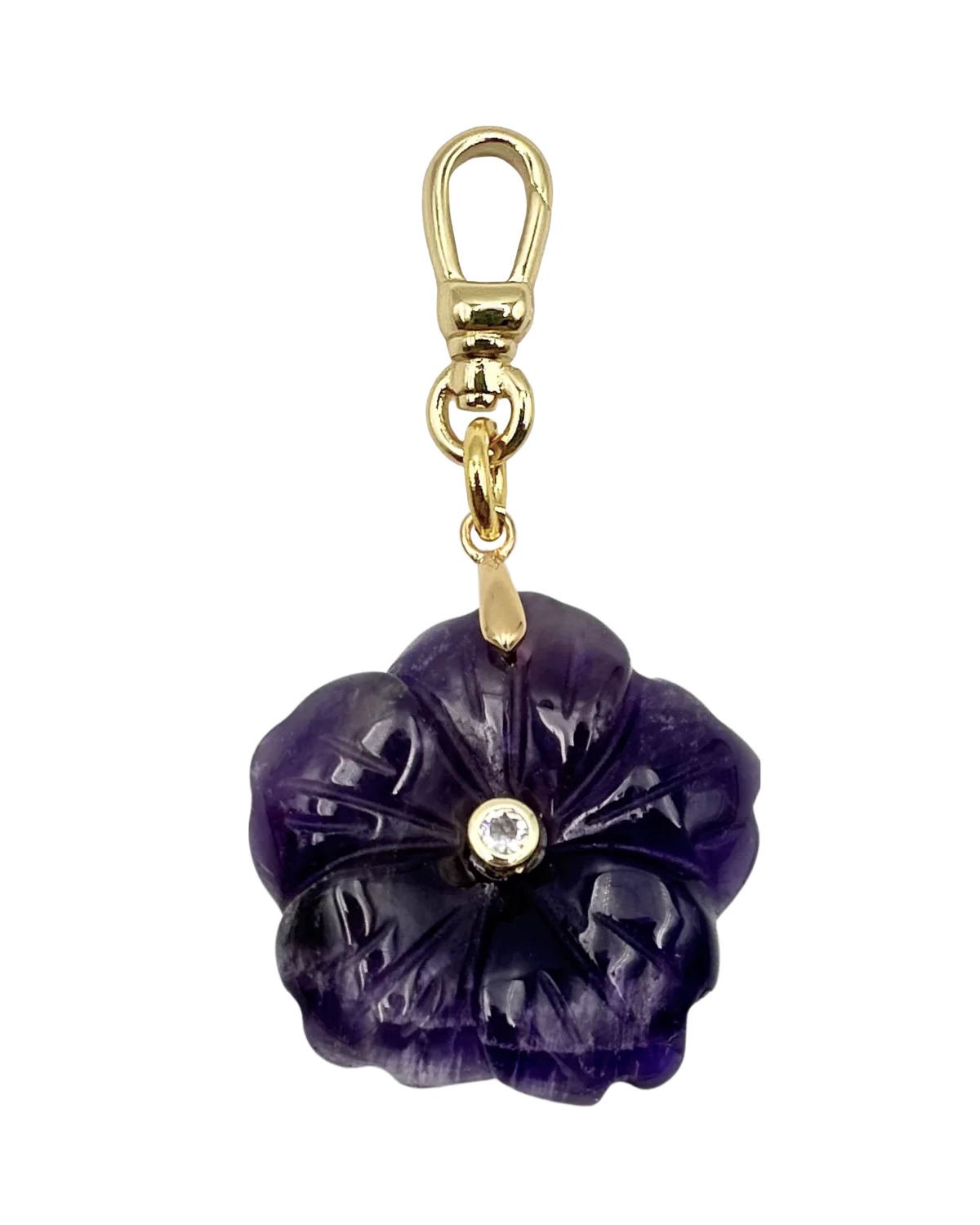 Purple flower-shaped keychain with gold accents on a white background