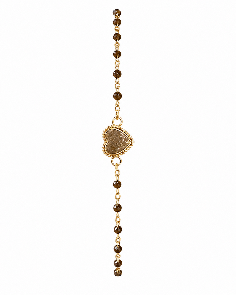 A delicate gold chain bracelet featuring a central textured gold heart charm and small dark brown beads on either side, shown against a plain white background.