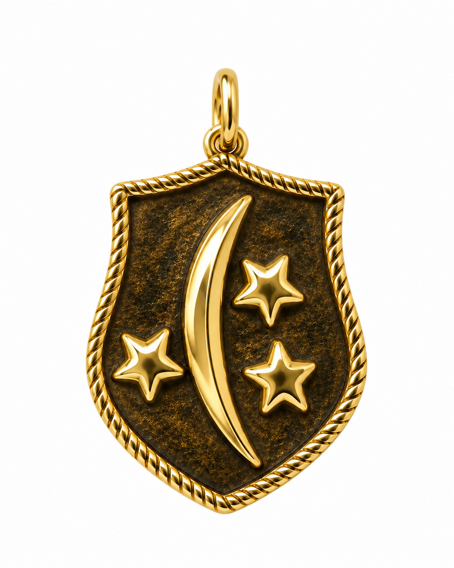A gold shield-shaped pendant with a twisted rope border, featuring a crescent moon and three stars on a dark textured background, shown on a plain white background.