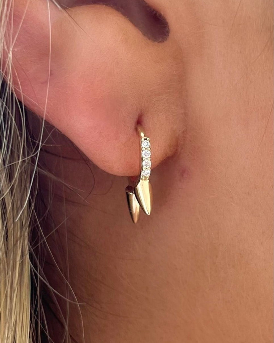14kt yellow gold diamodn huggy with gold spikes dropping down  @dylanjamesjewelry.com