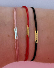 14kt gold bar engraved  on string bracelet  @dylanjamesjewelry.com