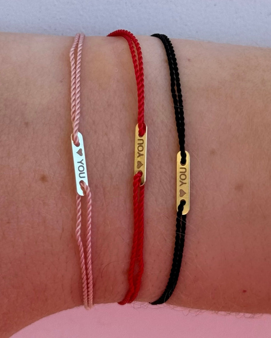 14kt gold bar engraved  on string bracelet  @dylanjamesjewelry.com