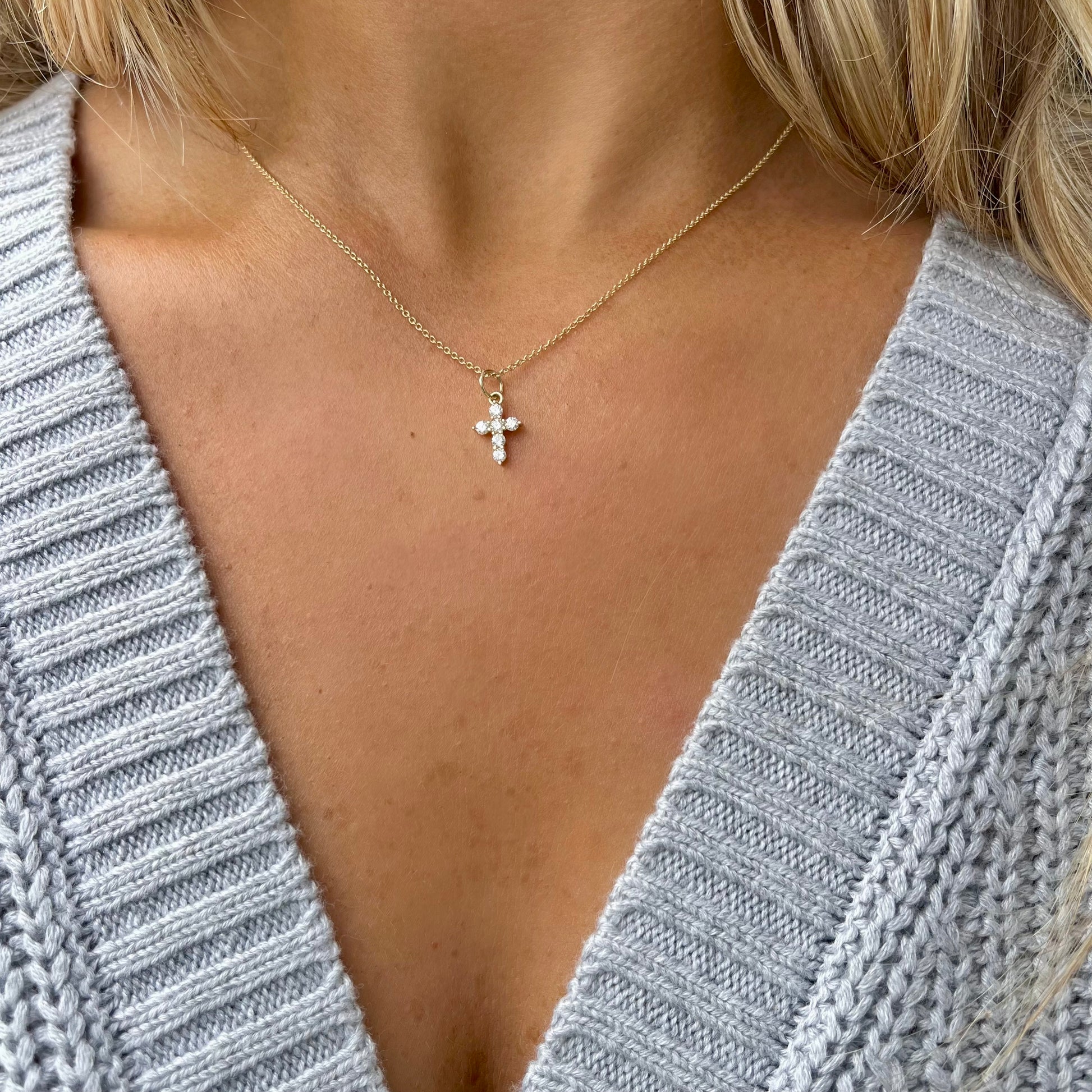 14kt yellow gold diamond cross char,m on a gold chain  @dylanjamesjewelry.com