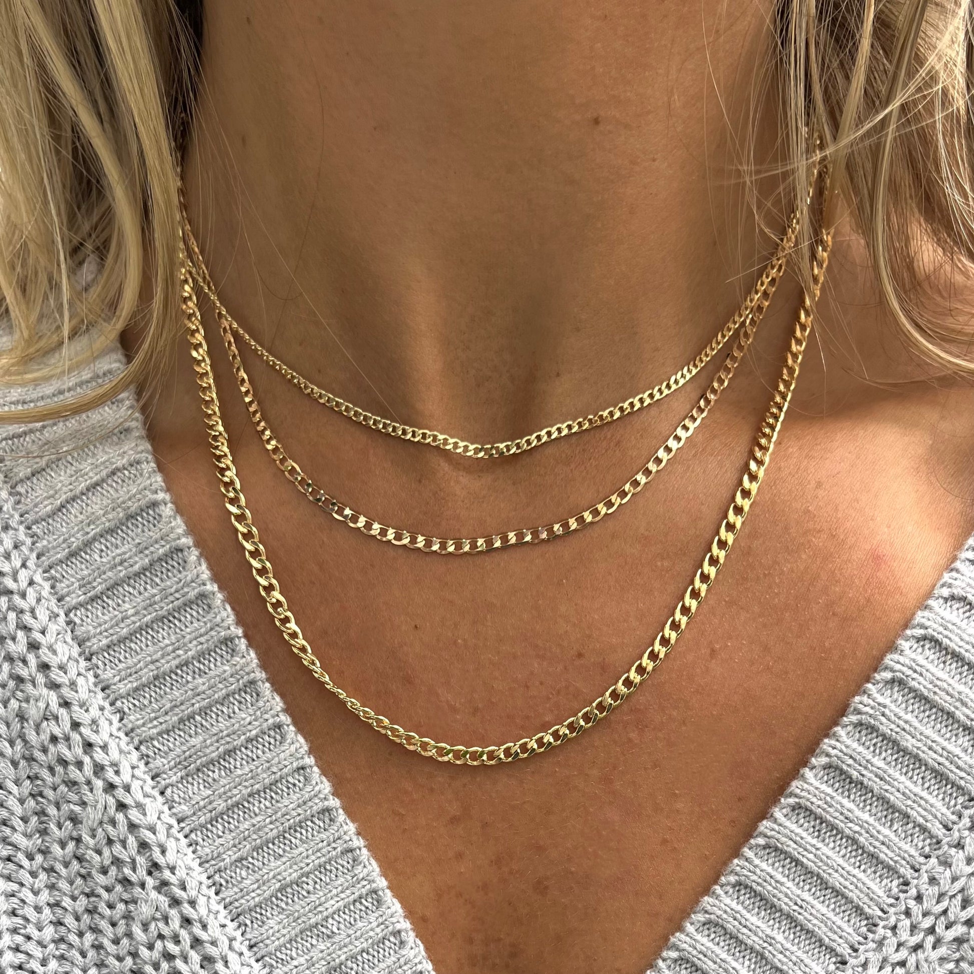 triple chain gold necklace already layered for you 3 varying size curb chains.  @dylanjamesjewelry.com