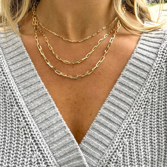 layering chain 3  varying size gold paperclip chains attached at the back.. @dylanjamesjewelry.com