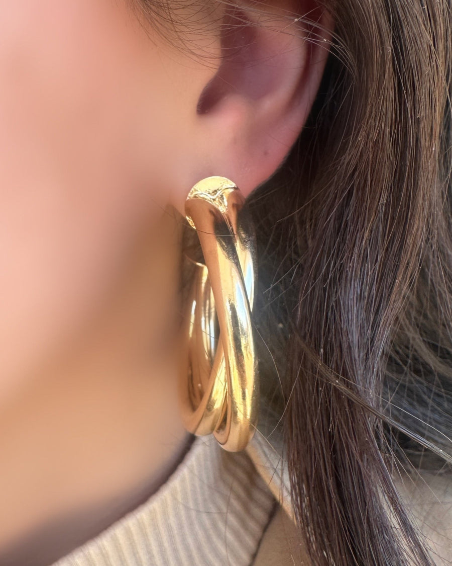 Large gold hoop earrings @dylanajmesjewelry.com