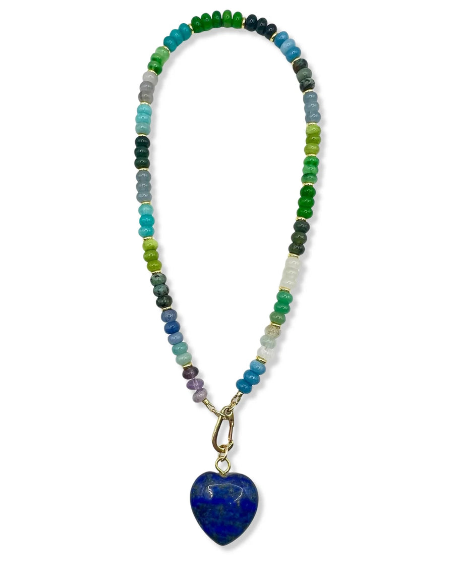 Necklace with multicolored beads and a blue heart pendant on a white background
