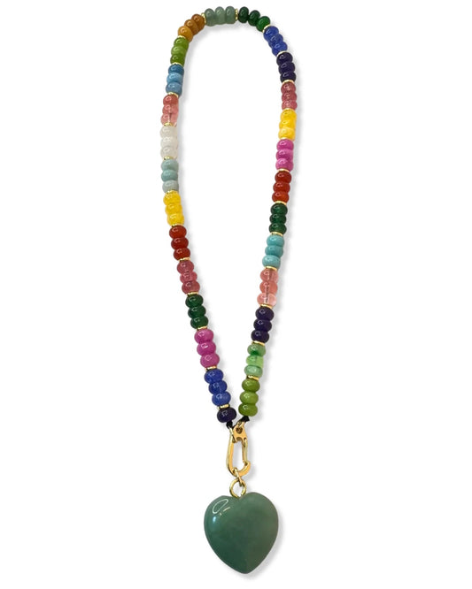 Colorful beaded necklace with a green heart pendant on a white background
