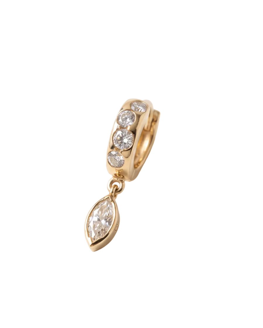 A gold huggie hoop earring with clear gemstones, featuring a dangling marquise-cut stone, shown on a clean white background.