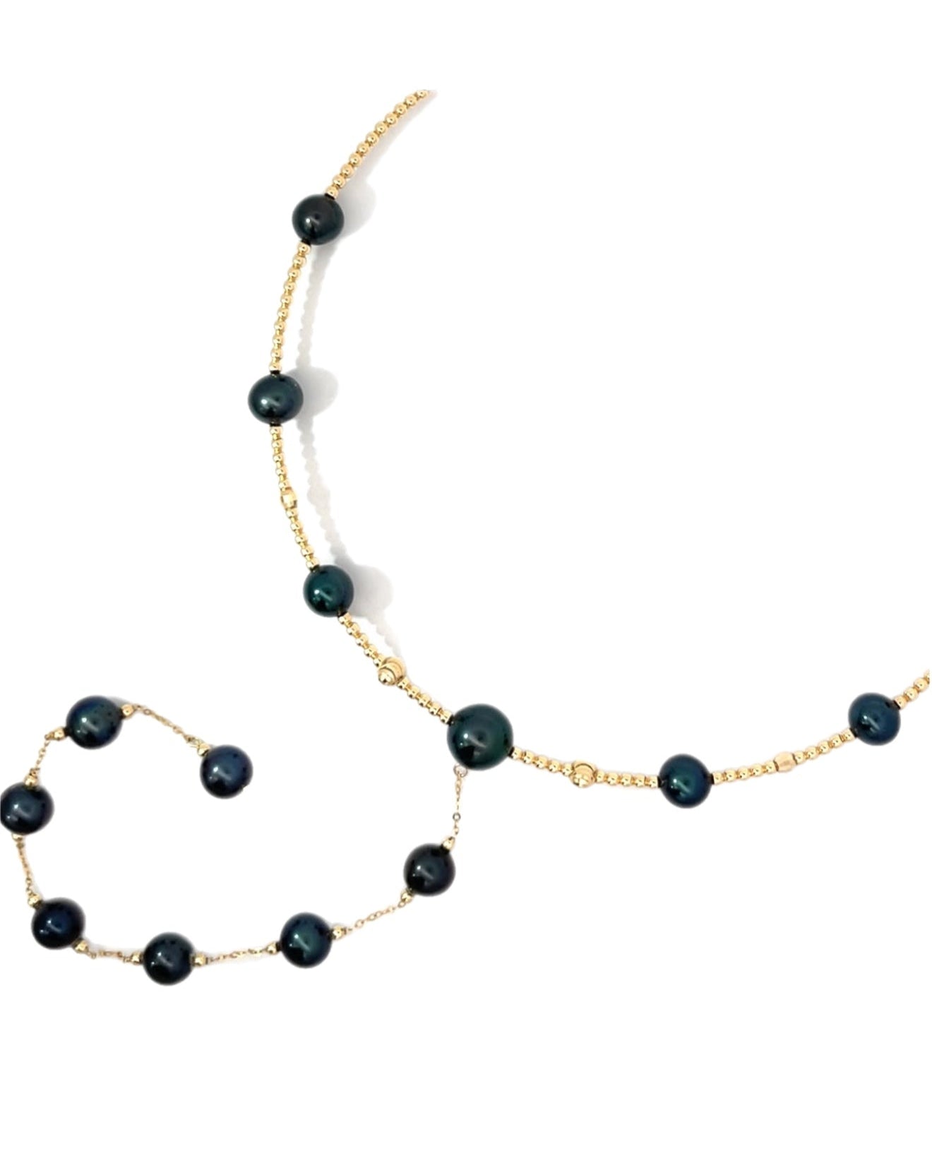 Necklace with black PEARLS on a YELLOW gold BEADED bendy comfortable wire against a white background