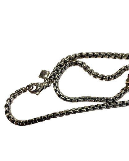 Silver chain necklace on a white background