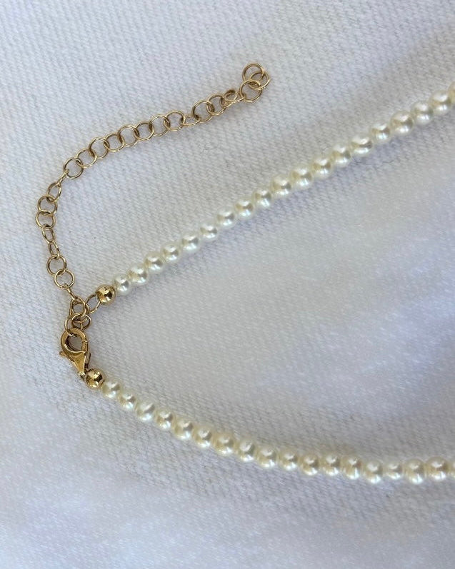 Pearl necklace on a white background