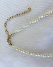 Pearl necklace on a white background
