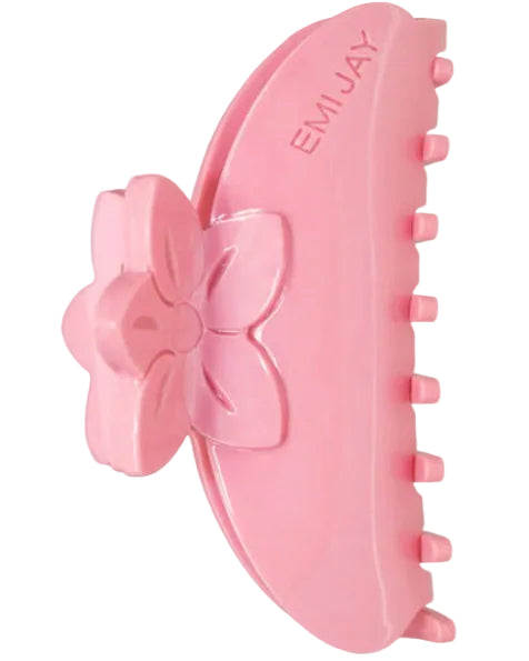 Pink hair claw with a floral design on a white background