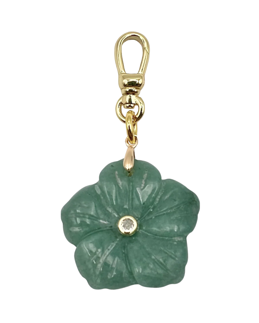 Green flower-shaped pendant with gold chain on a white background