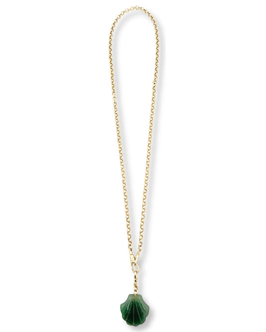 Gold chain necklace with a green pendant on a white background