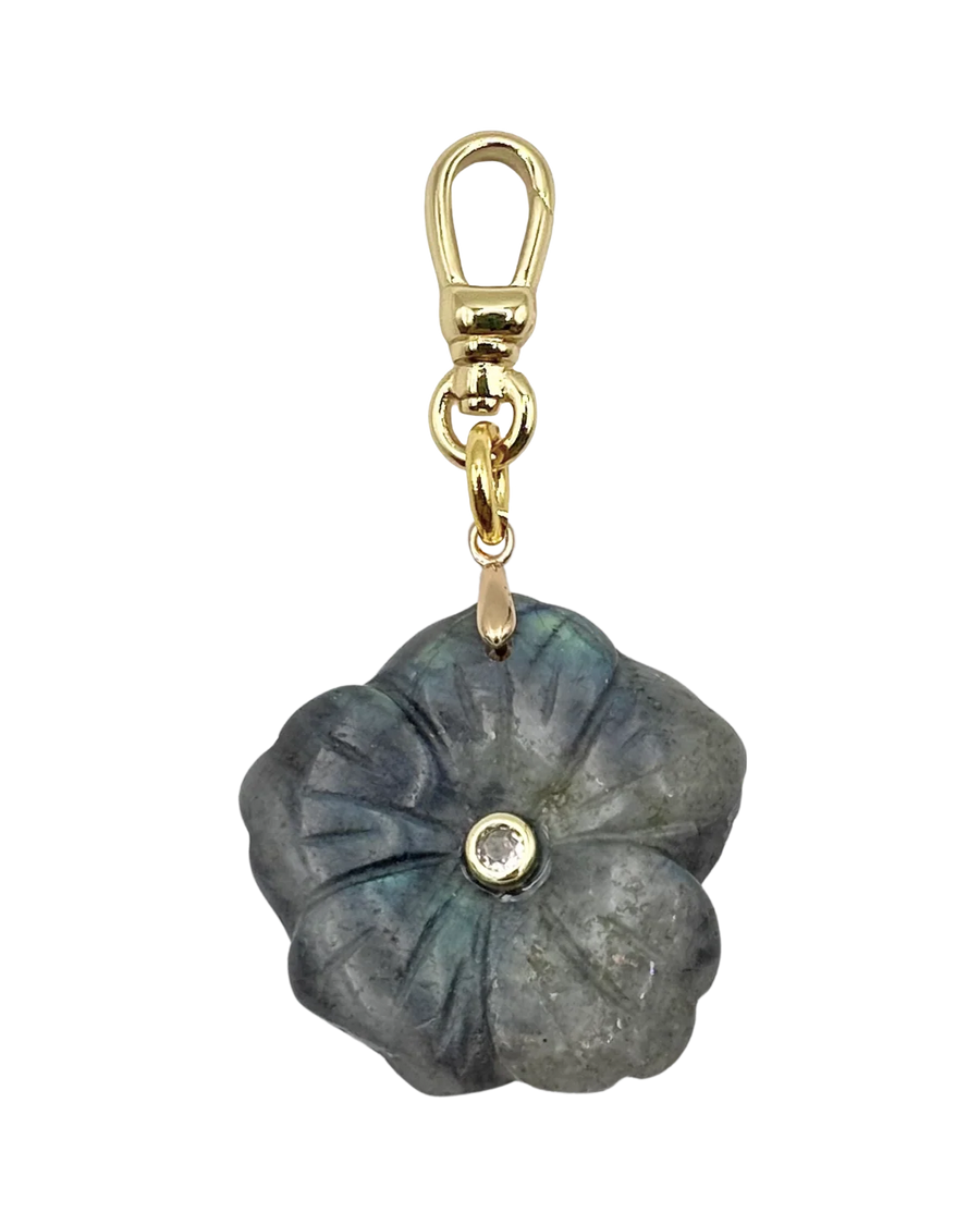 Floral-shaped keychain with gold clasp on a white background