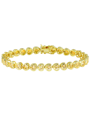 A yellow gold tennis bracelet with heart-shaped clear gemstones, displayed against a solid white background.