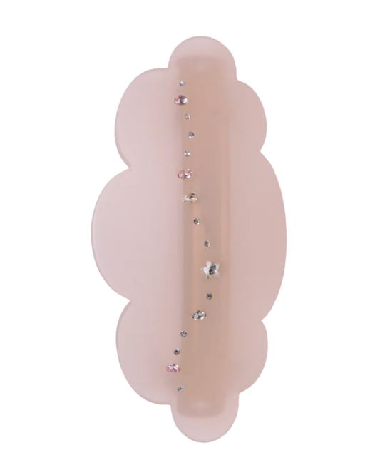 Pink decorative item with gemstones on a white background